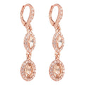ARETES COLOR ORO ROSA, GIVENCHY, FORMA OVALADA TIPO COLGANTE LARGO DE CRISTALES COLOR ORO ROSA, CIERRE TIPO GANCHO FRANCÃ‰S, FAMILIA SWEET ESCAPE, CONTENIDO 1 PAR DE ARETES
