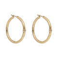ARETES COLOR  DORADO, RALPH LAUREN, FORMA CIRCULAR  TIPO ARRACADA CON CRISTALES TRANSPARENTES, CIERRE TIPO BISAGRA CON CLICK, FAMILIA LINDELLA, CONTENIDO 1 PAR DE ARETES