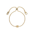 PULSERA COACH PAVE TURNLOCK DORADO